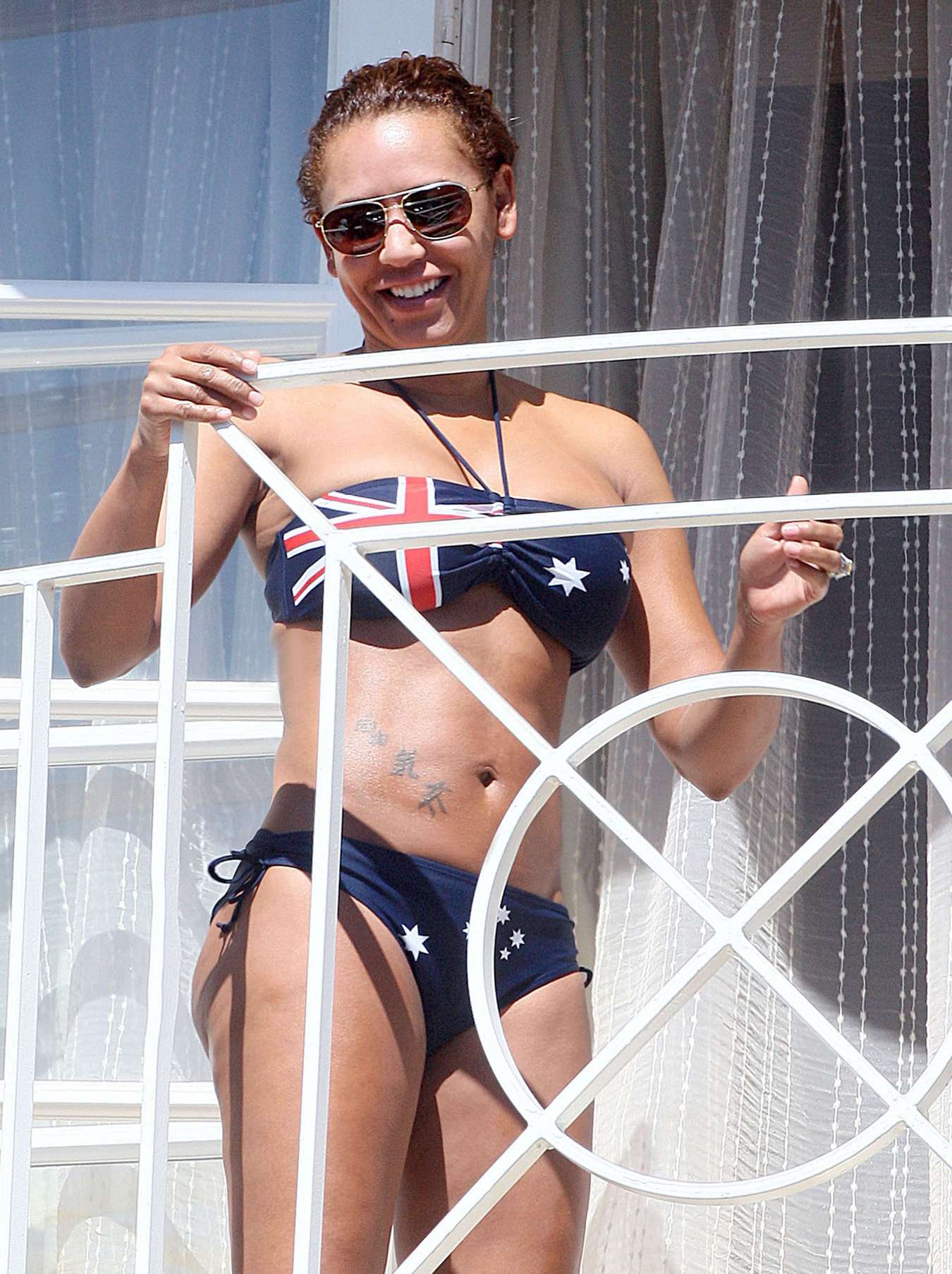 Melanie Brown - Bikini Candids on Balcony in LA